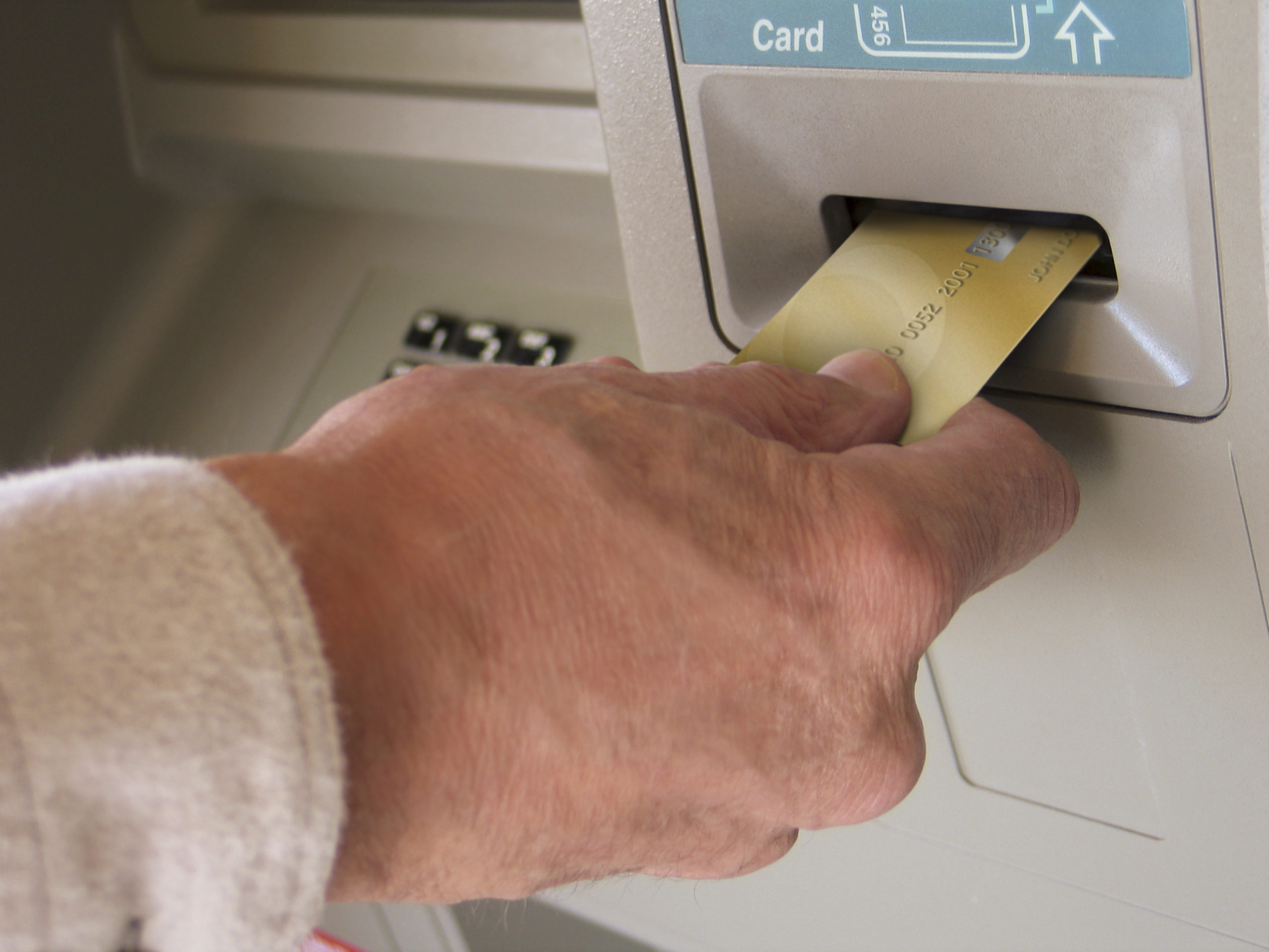 inserting card into ATM